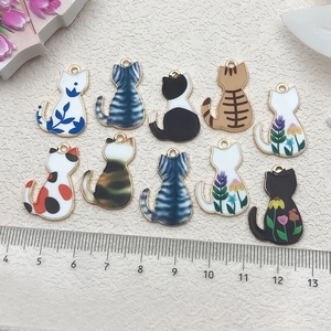 Detailed scale view of 10 assorted enamel cat charms for DIY jewelry making crafts