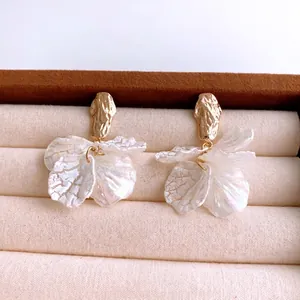 Maillard silver needle acrylic petal drop earrings with gold hammered finish in jewelry box