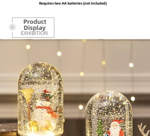Detailed view of the Christmas snow globe featuring Santa Claus and snowman with LED lights