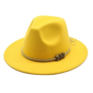 Detail of a bright yellow wide-brim fedora hat with a woven rope and tribal beads