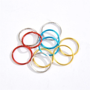 Colorful metal hair braid rings set in gold, silver, red, and blue for hair styling