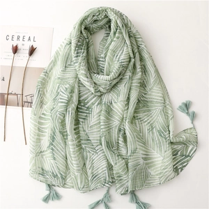 Bohemian style blue banana leaf print sun shawl with fringe tassels on white background
