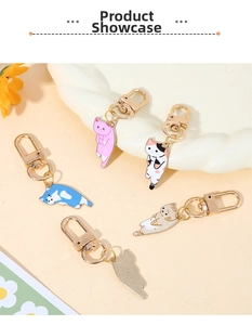 Detail view of five assorted colorful cat enamel charms with gold metal lobster clasps