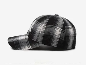 Side view of checkered baseball cap showing white embroidery and six-panel structure