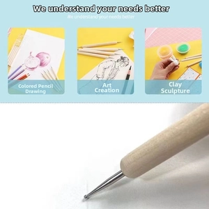 Detail of wooden embossing stylus set with dual-head metal tips for clay and art sculpting