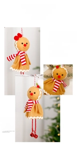 Detailed view of gingerbread plush pendant with red scarf and bell on Christmas tree