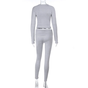 Detail of high-waist yoga leggings with pleated waistband in grey marl knit fabric