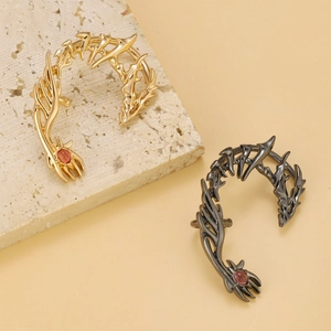 Gothic dragon claw ear cuff in gold and gunmetal finish with red zircon stone inlay