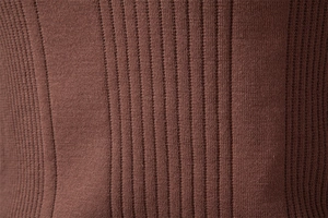 Close-up of brown knit polo sweater showing detailed ribbed texture and soft fabric quality