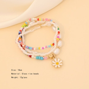 Detail view of a colorful seed bead bracelet with daisy charm, size 18cm and 12g weight