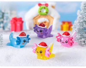 Miniature axolotls with Christmas hats displayed in a snowy holiday landscape scene