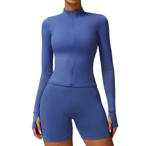 Women's dark blue zip-up fitness jacket and matching high-waist shorts seamless gym set