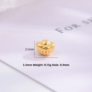 Detailed macro view of S925 silver gold-plated ingot spacer bead with 0.9mm hole size