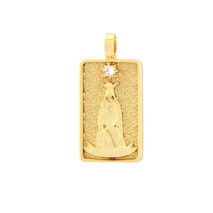 Detailed close-up of a gold rectangular pendant featuring a relief portrait and a clear zircon