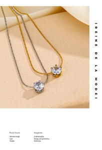 Detailed close-up of gold and silver six-prong cubic zirconia pendant necklaces