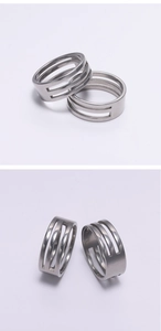Close-up of industrial style silver stainless steel triple layered hollow open ring design