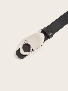 Detail of a black leather belt featuring an oval hollow silver metal buckle for women