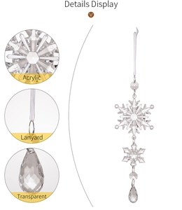 Macro detail of acrylic snowflake ornament showing transparent texture and water drop pendant