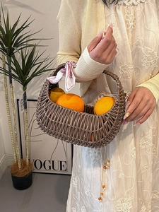 Fashionable brown woven basket handbag for women with decorative pink printed silk scarf
