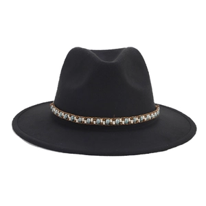 Macro detail of black wool felt fedora featuring a colorful ethnic beaded hat band