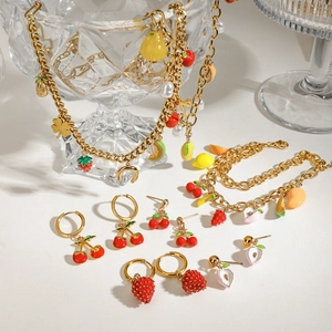 Colorful fruit necklace and bracelet set with strawberry and cherry charms in gold finish