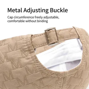 Khaki baseball cap featuring jacquard M pattern and adjustable silver metal buckle