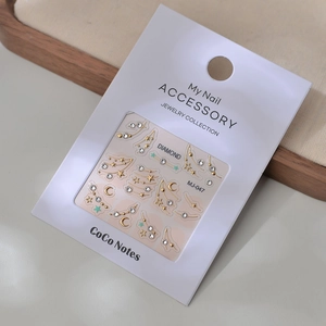 Detail of MJ-047 nail art stickers with moon and star motifs featuring high-quality K9 crystals