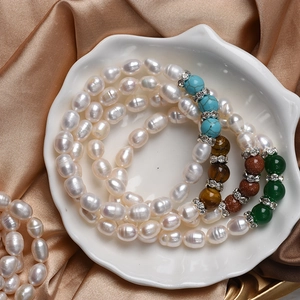 Natural freshwater pearl and agate beaded stretch bracelet on a decorative shell plate
