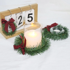 Christmas pine needle napkin ring set with red plaid bow and wood calendar scene