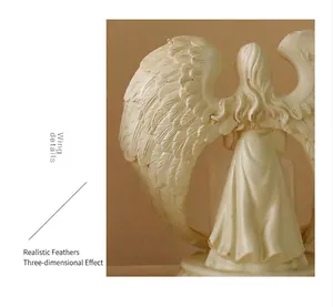 Detailed view of the intricately carved resin angel wings with realistic feather textures