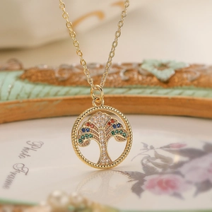 Gold tree of life necklace featuring colorful zircon stones and hollow round pendant
