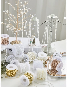 Detailed rolls of decorative pearl bead chains in various colors for Christmas tree ornaments