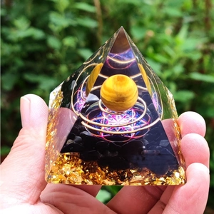 6cm Orgone Pyramid with gold foil, crushed stone, and copper wire wood sphere