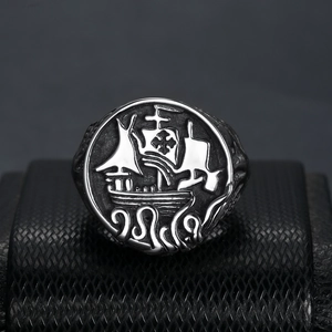 Close-up of vintage silver nautical sailing ship ring with oxidized metal details