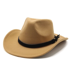 Detail of camel wool felt western cowboy hat with black leather strap and gold buckle