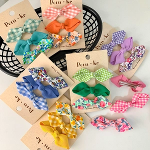 Three-piece set of Korean style floral and plaid bow hair clips for girls on display card