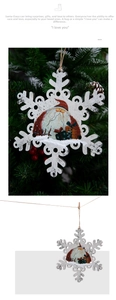 Detail of wooden snowflake ornament featuring Santa Claus illustration and rustic hanging twine