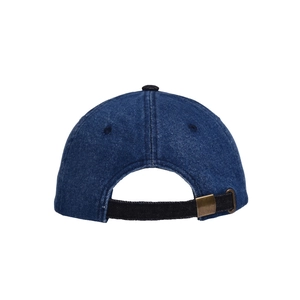 Detail view of washed denim baseball cap with adjustable black strap and copper buckle