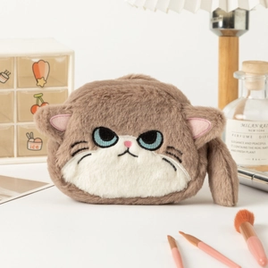 Macro detail of plush cat storage pouch showing soft fur texture and embroidered blue eyes