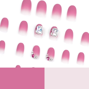 Pink and white ombre press-on nails with luxury heart rhinestones and crystals