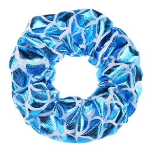 Close-up of blue mermaid scale pattern scrunchie with metallic iridescent finish