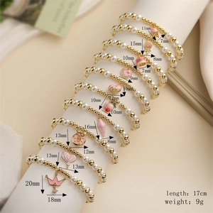 Detailed dimension chart for pink enamel charms on pearl and gold bead stretch bracelet
