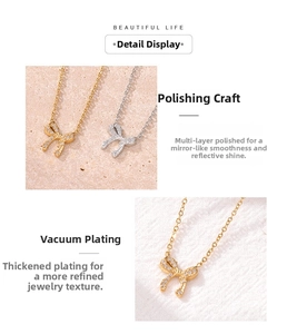 Detail showing polished bow pendant necklace with sparkling cubic zirconia in gold and silver