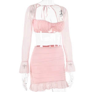 Detail of pink two-piece set with mesh flare sleeves and ruffled mini skirt on mannequin