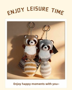 Detailed view of cute plush raccoon keychain charms with soft striped tails and metal clips