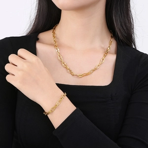 Gold-plated titanium steel coffee bean link necklace and bracelet set on model