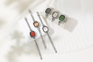 Detailed view of fashion rhinestone ladies watches with colorful dials and silver mesh bands