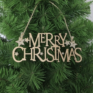 Wooden Merry Christmas hanging sign with hollow lettering on a festive pine tree branch