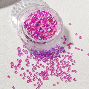 Detailed view of iridescent mermaid glass beads in mixed sizes for nail art decoration