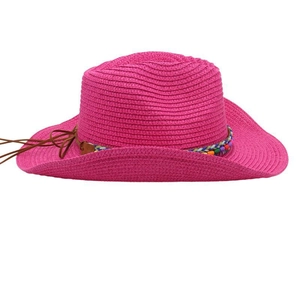 Detailed texture of dark pink straw sun hat with colorful beads and brown faux leather cord